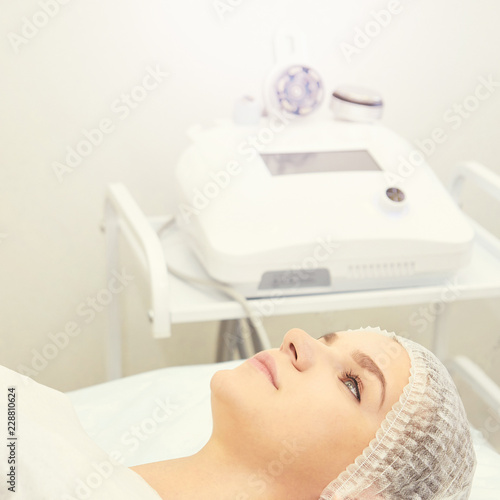 Facial micro current cosmetology procedure. Beauty technology treatment. Woman face therapy