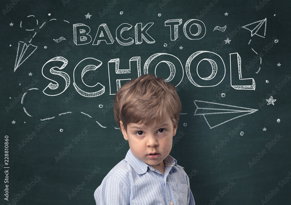 Adorable little boy with blackboard and back to school concept Adorable little boy with blackboard and back to school concept