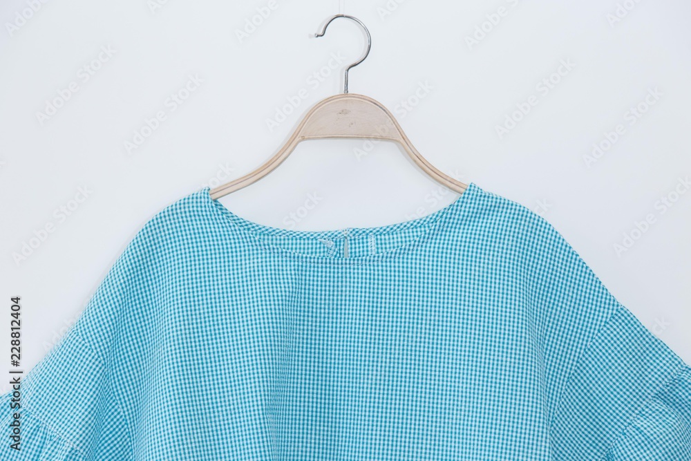 Blue colour blouse on white background.minimal style Blue colour blouse on white background.minimal style