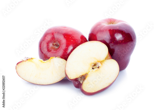 Red apples with apple slice on a white background.