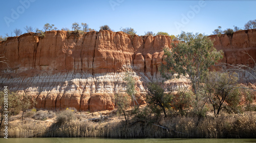 Landscape view of the red banded cliffs on the banks of the Murray River near Mildura in Victoria, Australia.