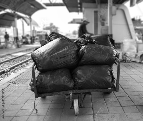 cart beside the road to look for garbages , Thailand.
