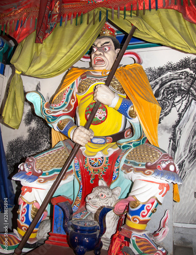 Dharmapala (protector of dharma), Buddhist temple in Beijing, China.   photo