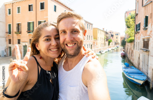 Sweet couple in love taking a selfie in Venice Italy while traveling around europe © SB Arts Media