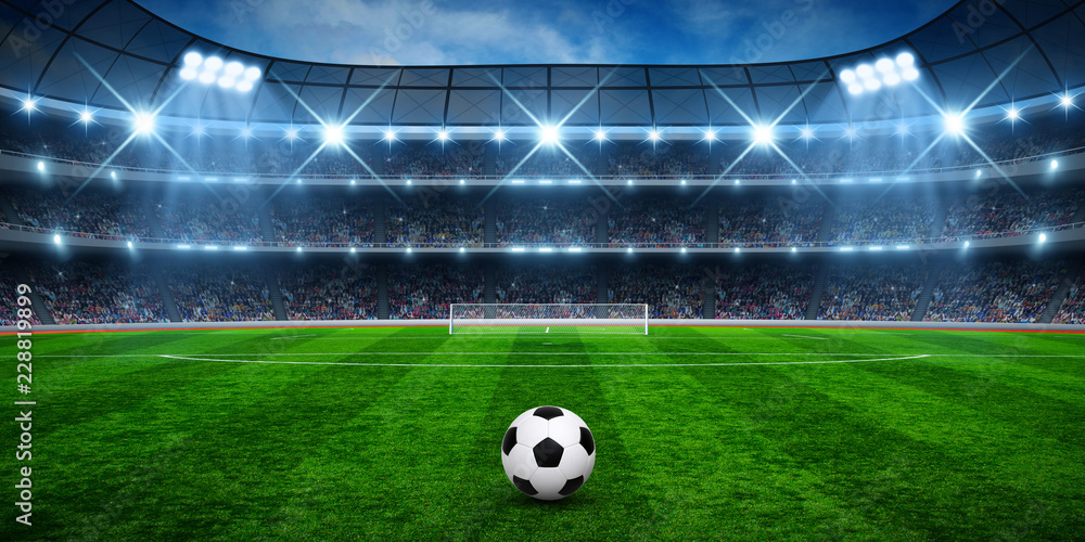 Naklejka Soccer ball on green stadium
