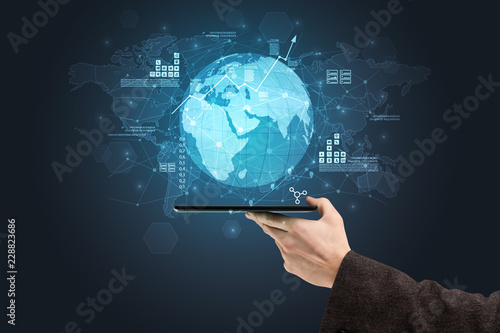 Hand using phone with multinational worldwide estate report concept 