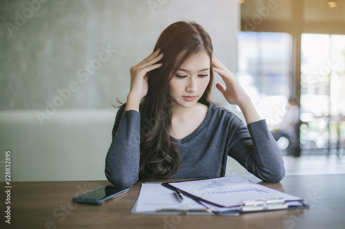 Asian business woman is stressed. Asian Young business woman unemployed. Asian office girl unemployed.