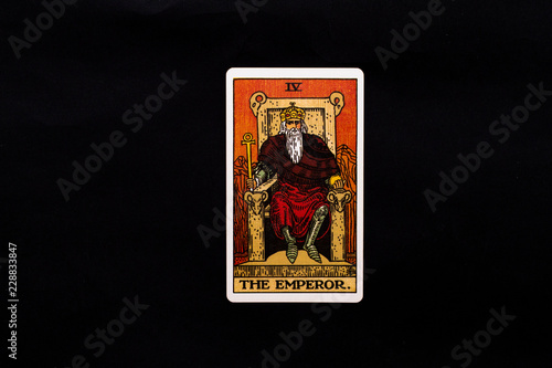 An individual major arcana tarot card isolated on black background. The Emperor.