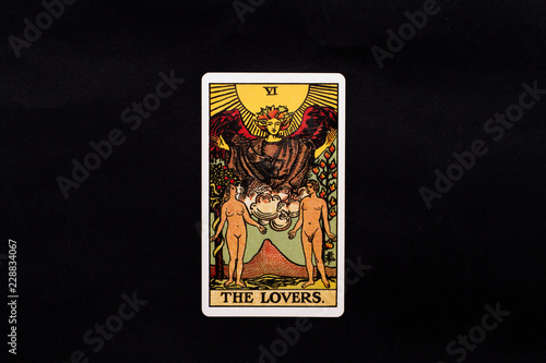 An individual major arcana tarot card isolated on black background. The Lovers.
