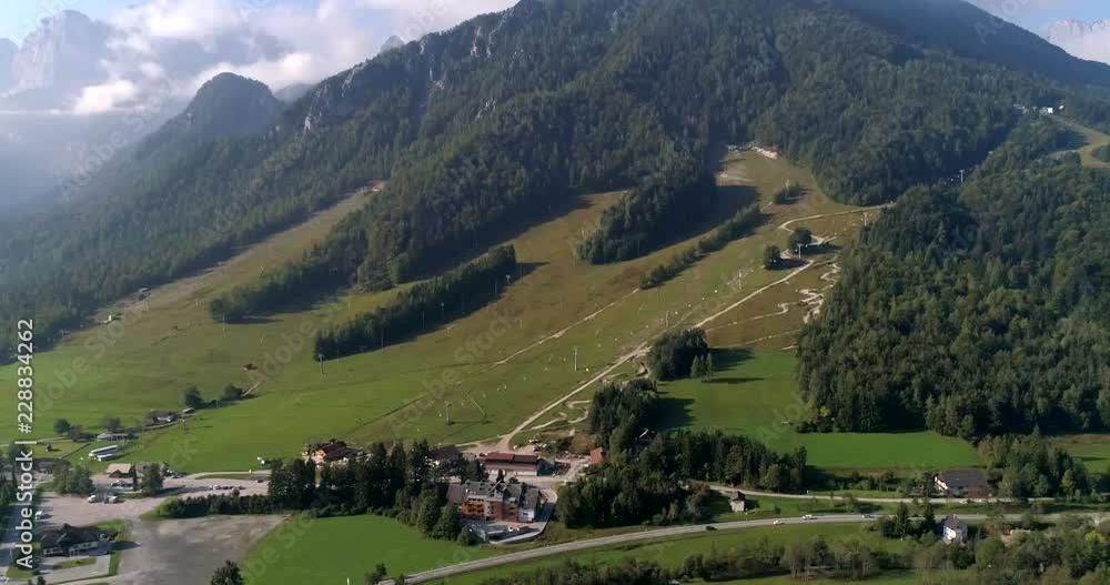 Alpine town, C4K aerial sideway, drone shot of Kranjska Gora village and Trigolov national park, on a sunny summer day, in the Julian alps, Slovenia Alpine town, C4K aerial sideway, drone shot of Kranjska Gora village and Trigolov national park, on a sunny summer day, in the Julian alps, Slovenia