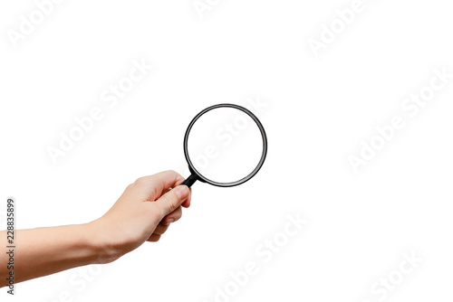 Femal hand holding magnidying glass. Detective and searchConcept. White background, isolated, close up