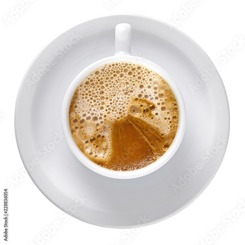 Capuccino in porcelain cup and white plate isolated on white background including clipping path.