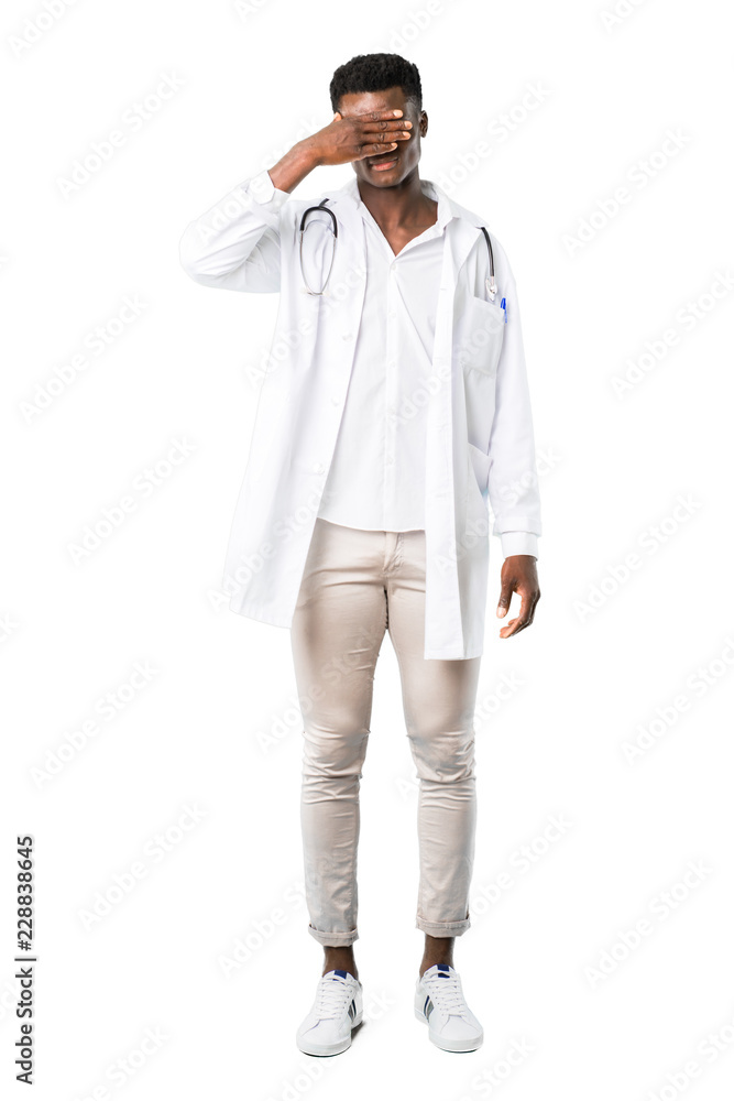 Full body of African american doctor covering eyes by hands. Do not want to see something on white background Full body of African american doctor covering eyes by hands. Do not want to see something on white background