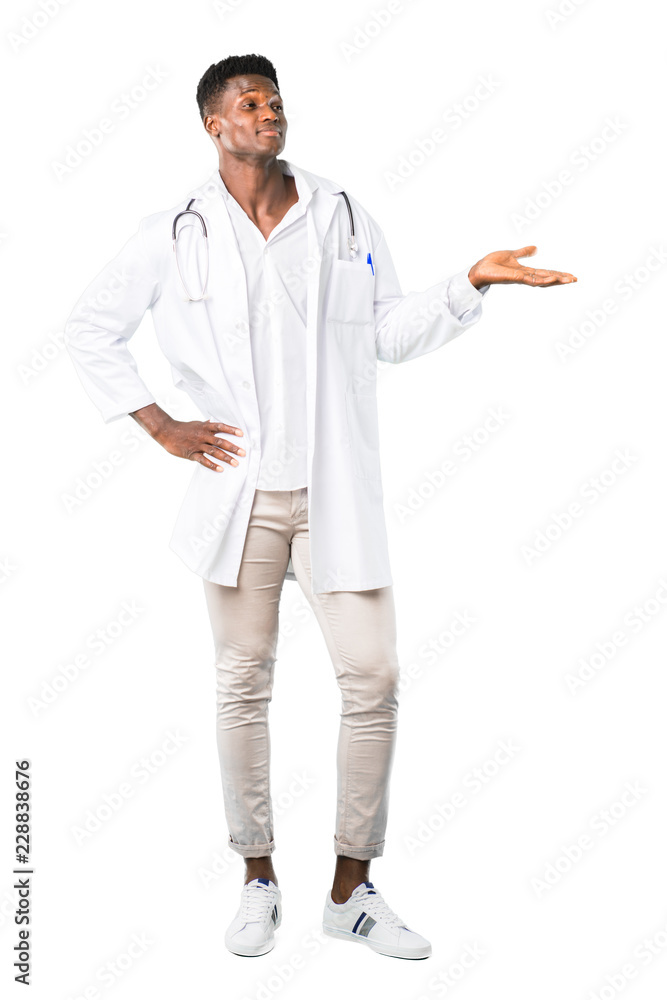 Full body of African american doctor holding copyspace imaginary on the palm to insert an ad on white background Full body of African american doctor holding copyspace imaginary on the palm to insert an ad on white background