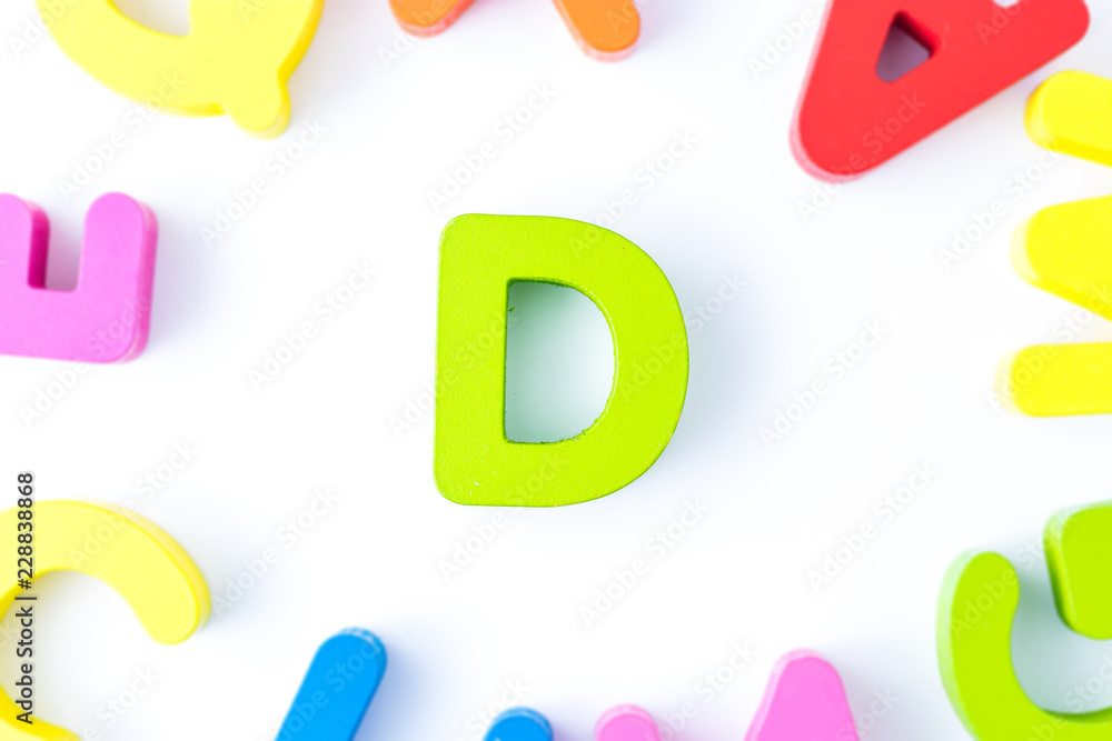 Naklejka premium D letters in English made from wood bright colors.