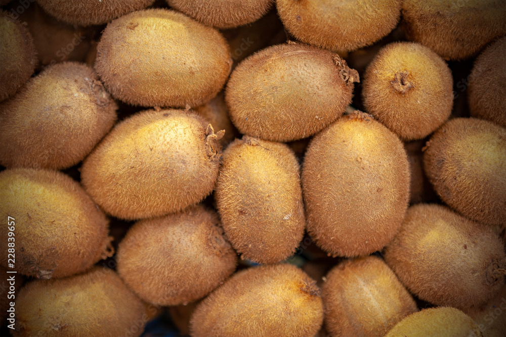 Fresh kiwi spread out evenly as a background. Fresh kiwi spread out evenly as a background.