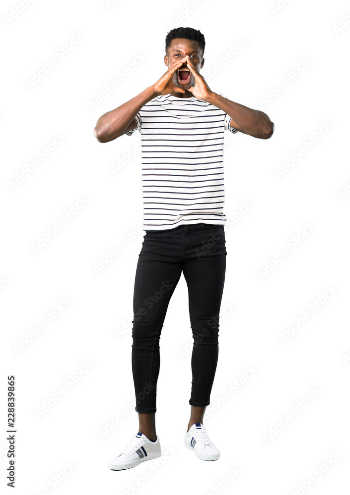 Full body of Dark skinned man with striped shirt shouting with mouth wide open to the lateral and announcing something on white background Full body of Dark skinned man with striped shirt shouting with mouth wide open to the lateral and announcing something on white background