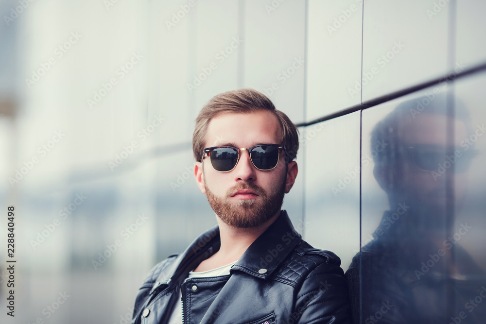 Portrait cool fashion man on street background Portrait cool fashion man on street background