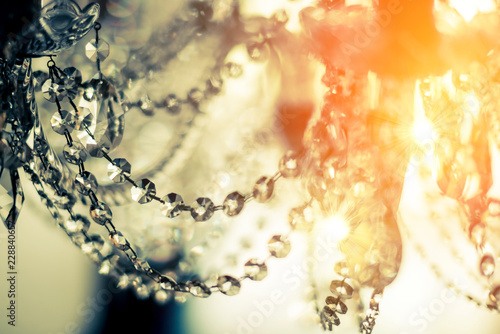 abstract image background of blur bokeh and crystal chandelier light equipment filter tone color effect © whyframeshot