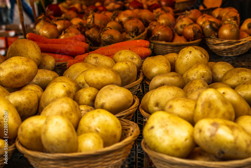 Fresh vegetables, potatoes, carots and onions on display at a farmers' market in Oxford in England -1 photo
