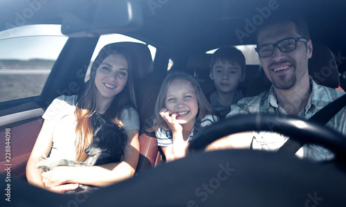 happy family rides in the car