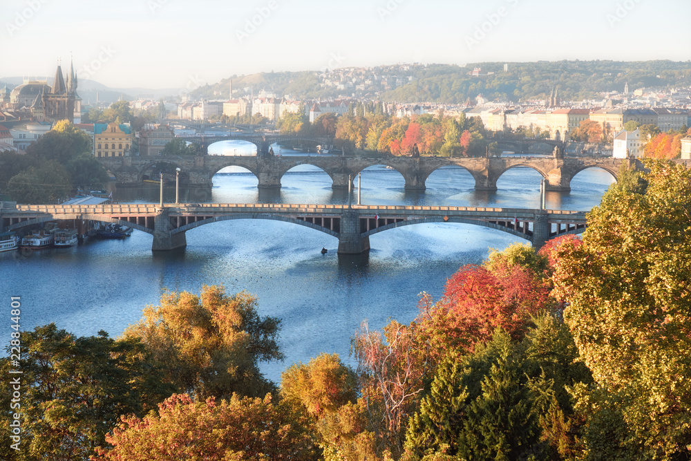 Central Prague and six bridges on Vltava river in Prague on a misty morning in Autumn