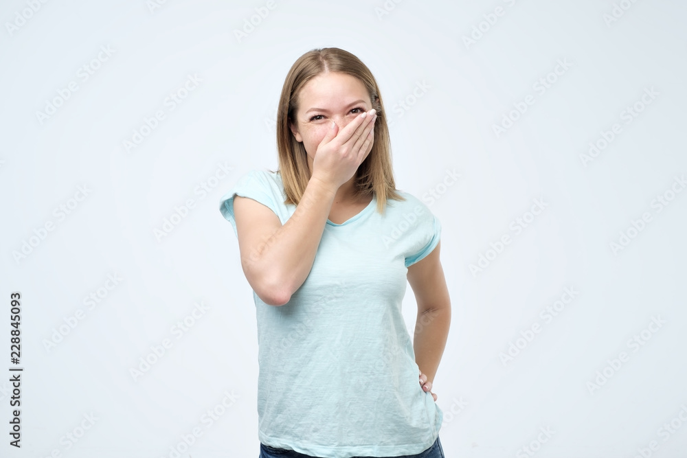 Young woman feels shy, receiving compliments from her friends or teacher. Young woman feels shy, receiving compliments from her friends or teacher.