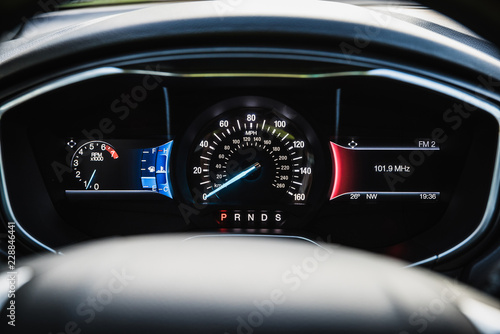 Fotografie Car dashboard with kmh and mph