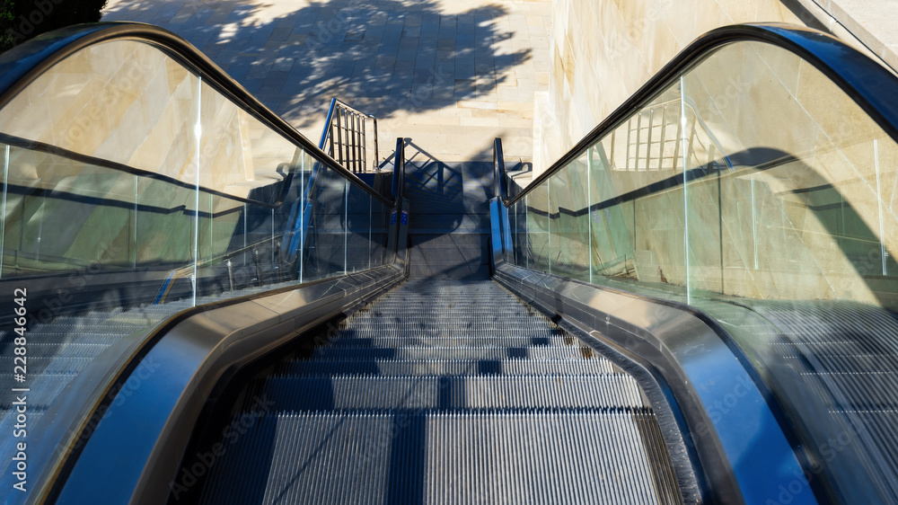 Fototapeta premium Escalator, crosswalk downhill