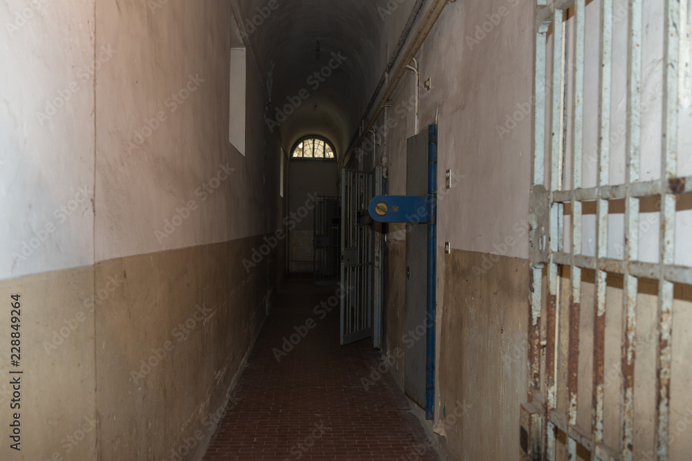 Long Corridor and White and Worn Walls of a Prison