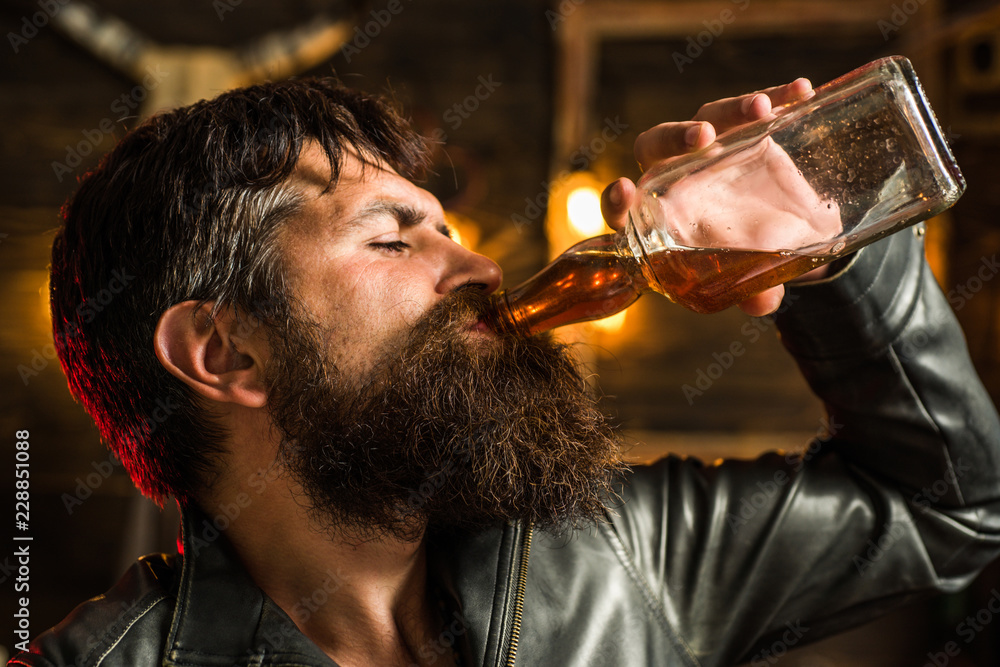 Man drinking alcohol. Whisky, brandy or cognac concept. Serious sad man having alcohol addiction. Alcohol addiction concept. Man drinking alcohol. Whisky, brandy or cognac concept. Serious sad man having alcohol addiction. Alcohol addiction concept.