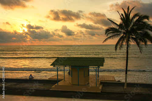 Small shelter in front of the ocean at sunset, Ecuador.