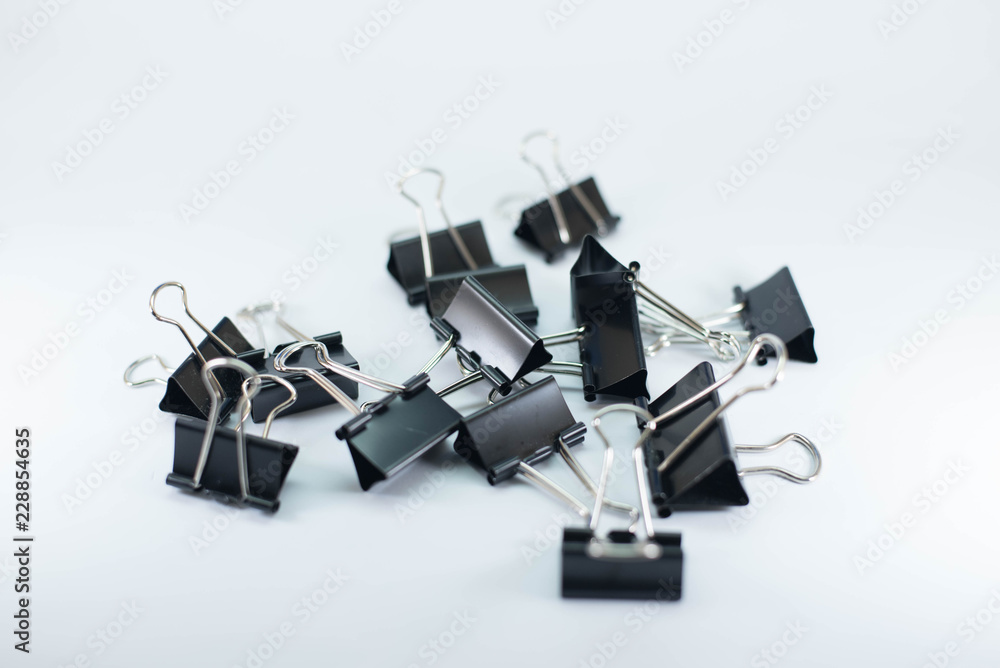 Naklejka premium Fold back clips on white background 