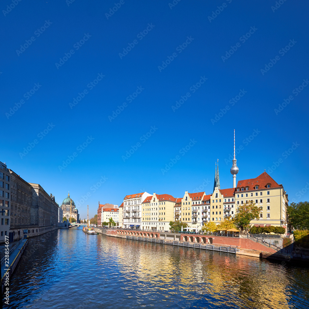 Riverside with old houses in East Center of Berlin, Germany, text space