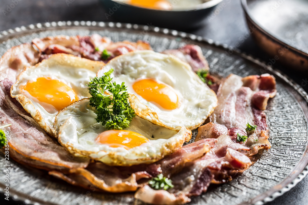 Close-up roasted bacon and egg with herbs. Close-up roasted bacon and egg with herbs.