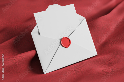 Open white envelope on red tissue