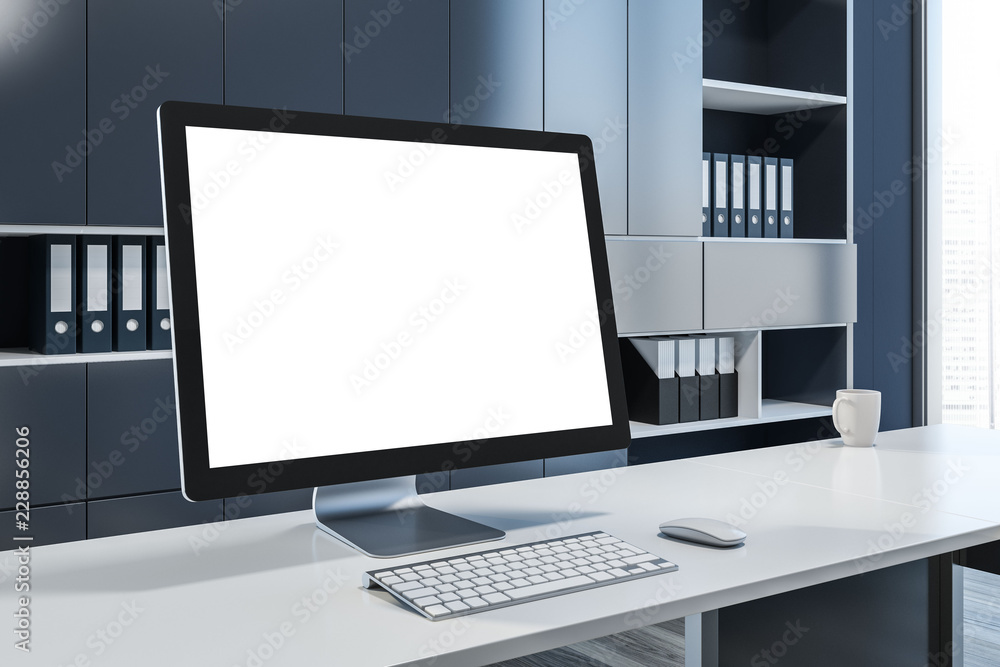Mock up computer screen in gray office interior Mock up computer screen in gray office interior