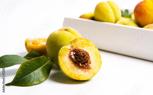 Yellow peach on white background