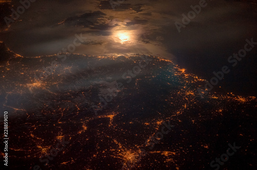 City lights at night along the France-Italy border. Satellite view. Elements of this image furnished by NASA.