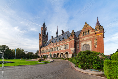 THE HAGUE, 26 September 2018 - Sunrise at the Peace Palace, seat of the International Court of Justice, view from the peaceful garden with flowers around the building