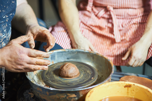 Master class on modeling of clay on a potter's wheel In the pottery workshop