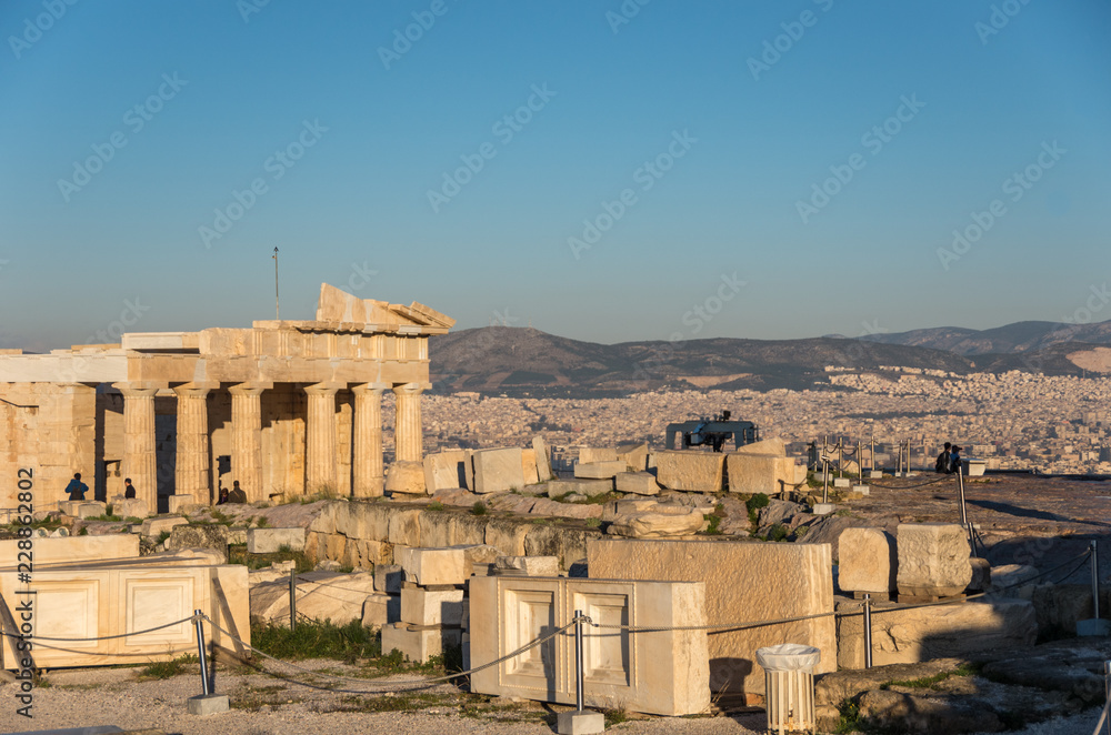 Ruins of Parthenon temple with monumental gateway Propylaea in the Acropolis of Athens, Attica, Greece