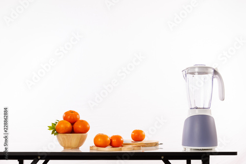 orange goldern and fruit shaker on the table photo