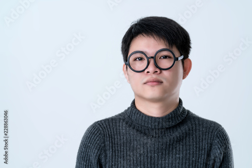 creative smart asian male with glasses facial emotional  portrait with happiness and confident feeling white background © whyframeshot