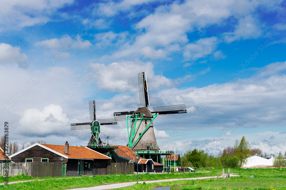 traditional Dutch rural scene with windmills of Zaanse Schans at spring, Netherlands