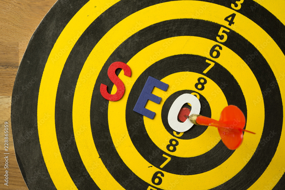 SEO Search Engine Optimization multi color logo alphabets ranking concept on dartboard background with red arrow hit center of target, SEO is one of online marketing business strategy to promote web SEO Search Engine Optimization multi color logo alphabets ranking concept on dartboard background with red arrow hit center of target, SEO is one of online marketing business strategy to promote web