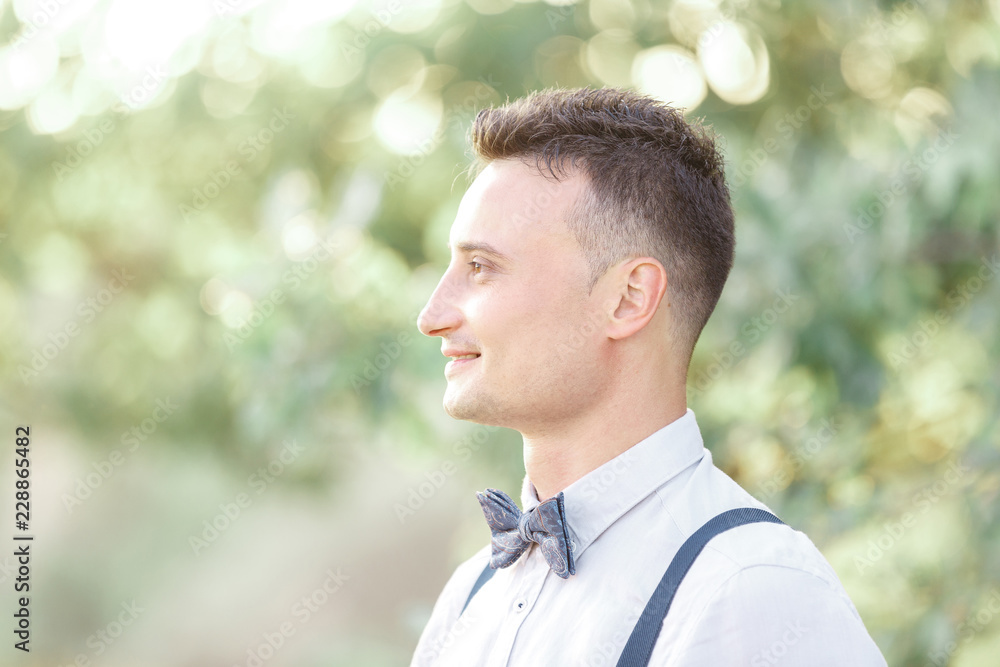 Portrait of a young handsome groom outdoors. Portrait of a young handsome groom outdoors.