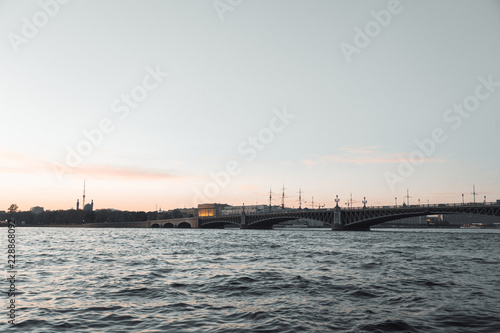 Elements of architecture of historical buildings. The streets of St. Petersburg with its bridges and rivers. Night view of the city at sunset.