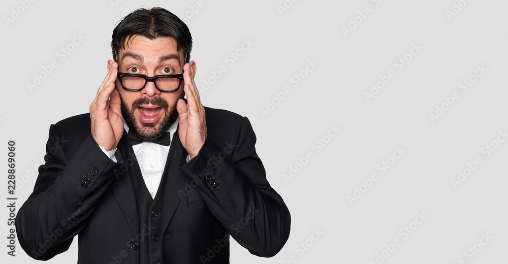 Surprised bearded man in tuxedo and eyeglasses Surprised bearded man in tuxedo and eyeglasses