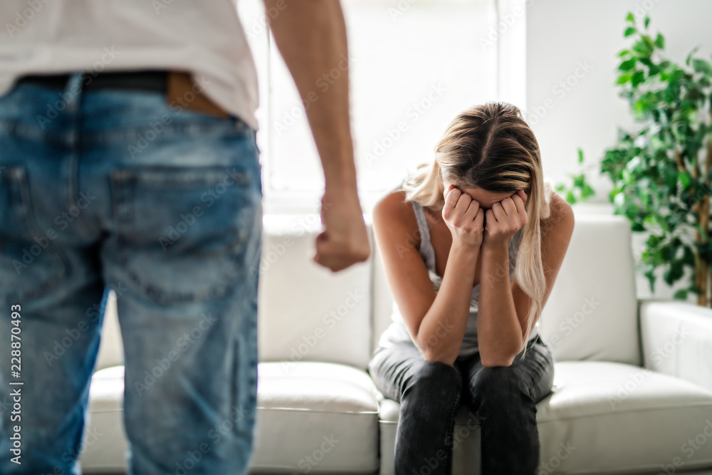 Man beating up his wife illustrating domestic violence Man beating up his wife illustrating domestic violence